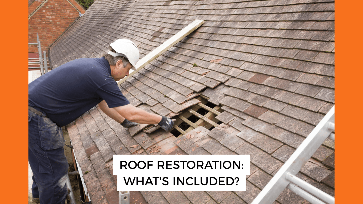 contractor inspecting roof tiles during a roof restoration